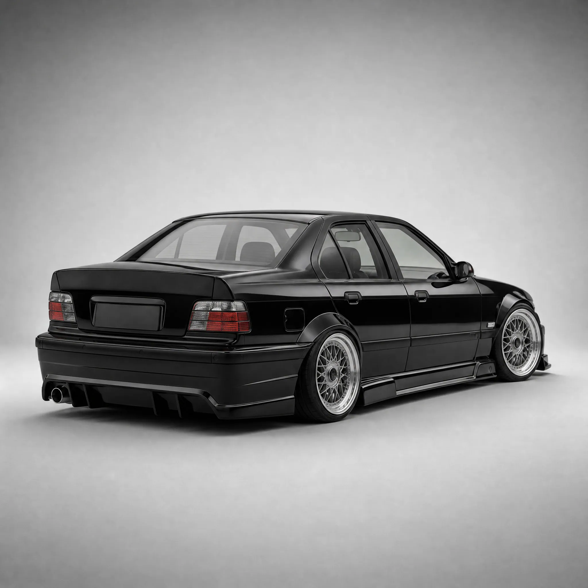 BMW E36 body kit fitted, gloss black, rear three-quarter view