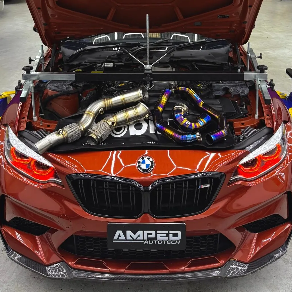 BMW F87 M2 Competition with EuroSpec S55 catless downpipes on the bonnet, ready to fit