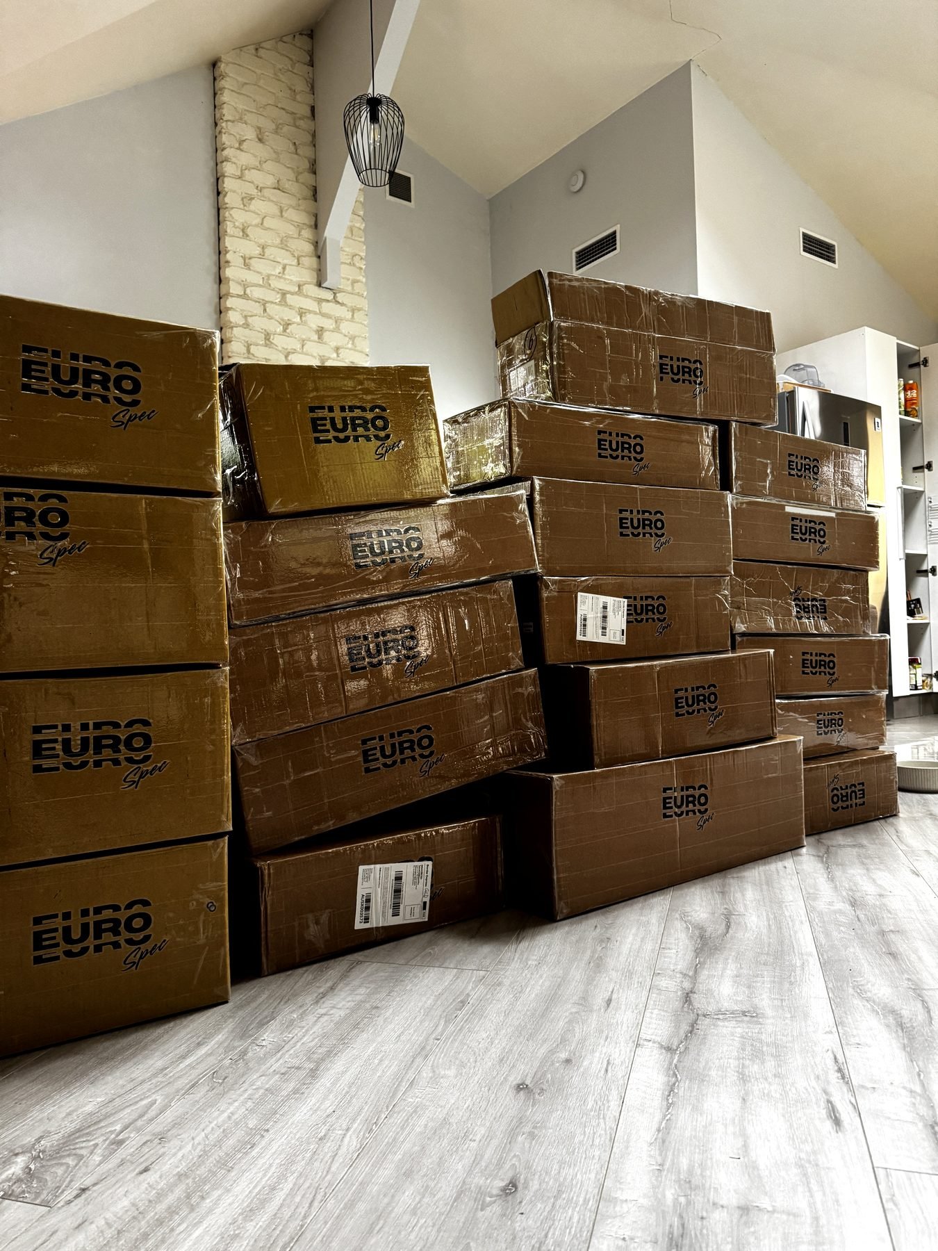 Stacks of EuroSpec-branded BMW performance parts boxes held in stock in Australia