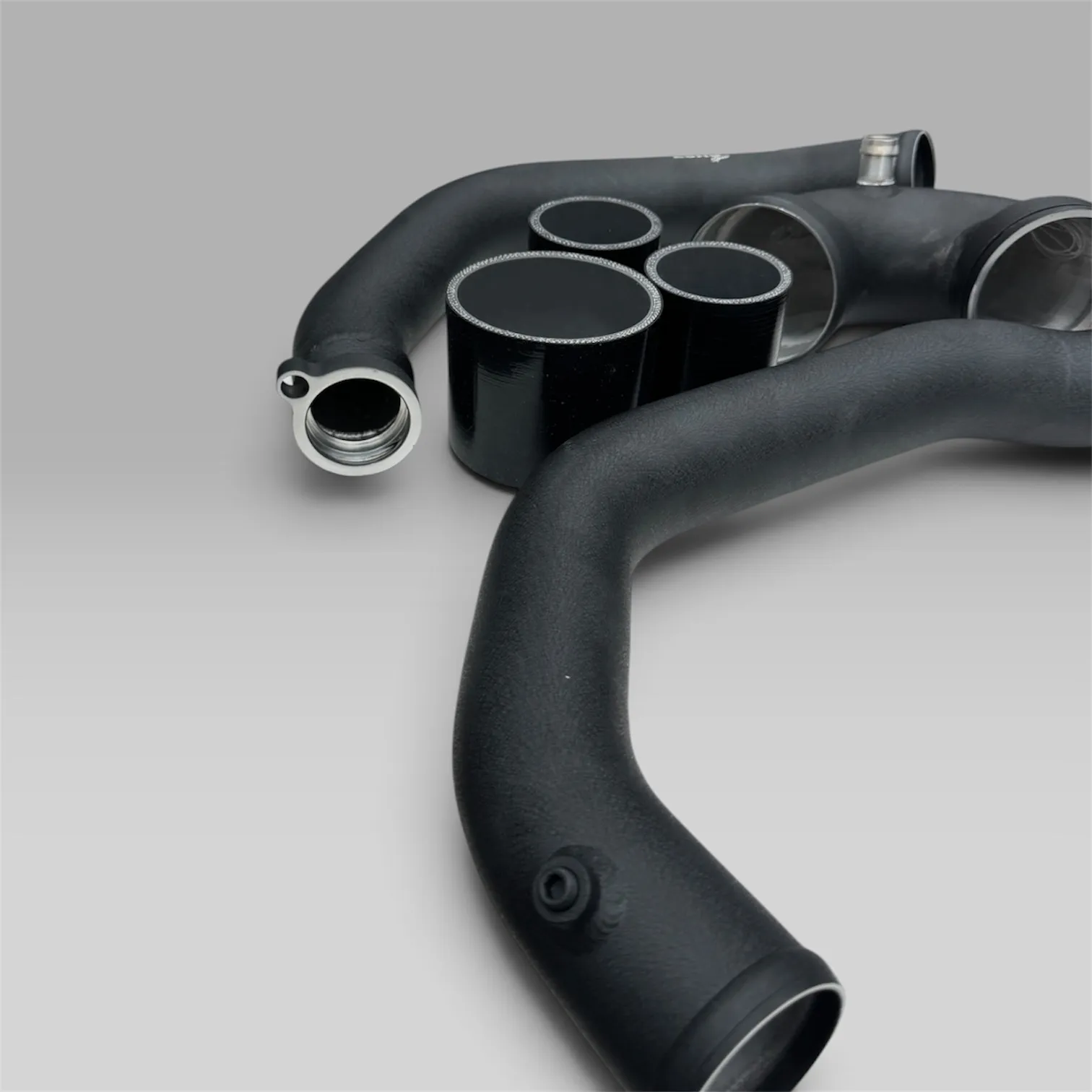 EuroSpec BMW S55 charge pipes with the silicone couplers included in the kit